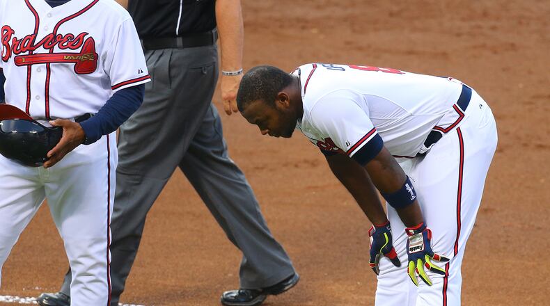 Braves Justin Upton reacts to being called out at first on a close play against the Phillies tryig to beat out a grounder during the first inning of an MLB game on Tuesday, June 17, 2014, in Atlanta. CURTIS COMPTON / CCOMPTON@AJC.COM