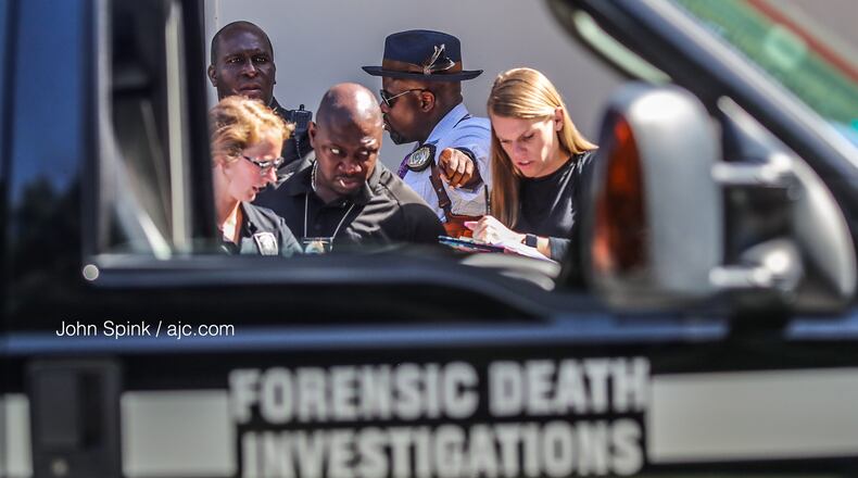 The body was found at a DeKalb County gas station at 3860 Panola Road Wednesday morning.