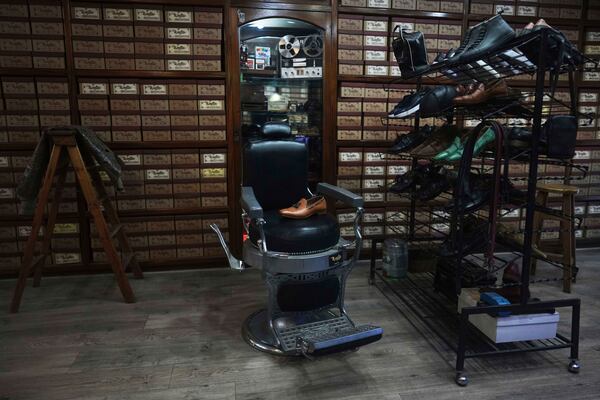 Shoes are displayed at the Muglia shoe store where the future Pope Francis, known as Jorge Bergoglio, used to buy his shoes in the Flores neighborhood where he grew up in Buenos Aires, Argentina, Thursday, April 24, 2025. (AP Photo/Natacha Pisarenko)