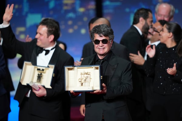 Director Jafar Panahi, accepts the Palme d'Or for the film 'It Was Just an Accident', during the awards ceremony of the 78th international film festival, Cannes, southern France, Saturday, May 24, 2025. (Photo by Lewis Joly/Invision/AP)