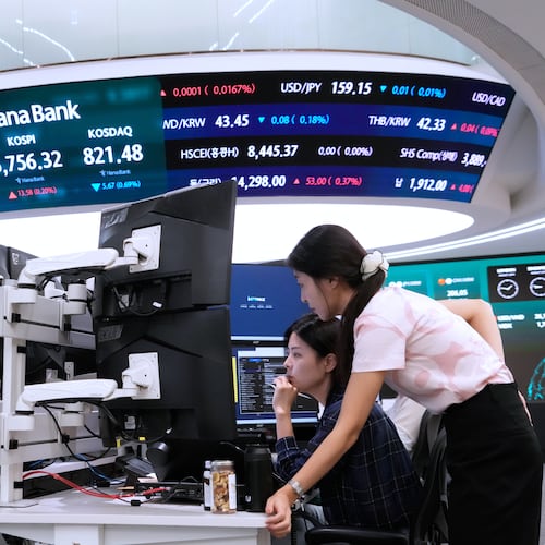 Currency traders watch monitors at the foreign exchange dealing room of the Hana Bank headquarters in Seoul, South Korea, Wednesday, Aug. 26, 2026. (AP Photo/Ahn Young-joon)