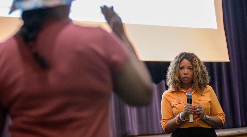 U.S. Rep. Lucy McBath, D-Ga., takes a question from Gwendolyn Farris during a town hall at Dunwoody High School earlier this month. Branden Camp/Special