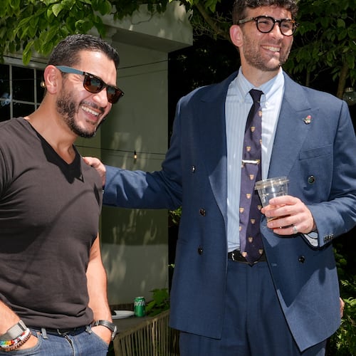 Abdul El-Sayed, a progressive candidate in the Democratic primary for U.S. Senate in Michigan, talks poolside with streamer Hasan Piker at a party for content creators supporting his campaign, Monday, Aug. 3, 2026, in Detroit. (AP Photo/Julia Demaree Nikhinson)
