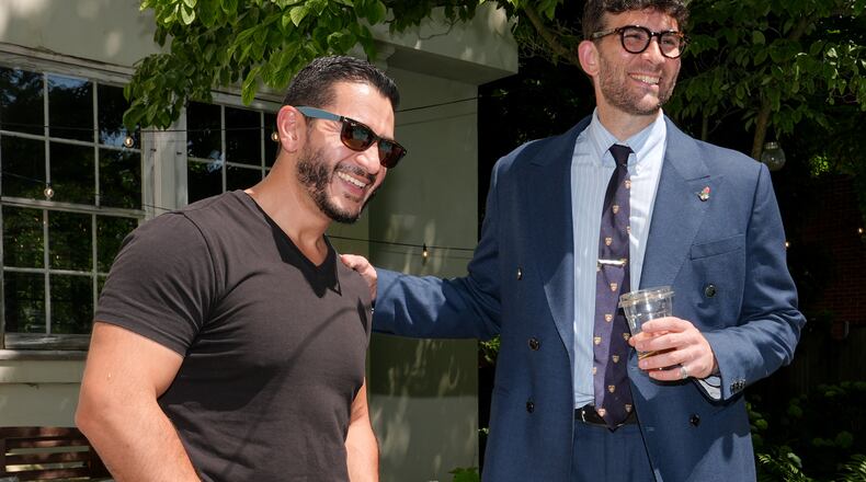 Abdul El-Sayed, a progressive candidate in the Democratic primary for U.S. Senate in Michigan, talks poolside with streamer Hasan Piker at a party for content creators supporting his campaign, Monday, Aug. 3, 2026, in Detroit. (AP Photo/Julia Demaree Nikhinson)