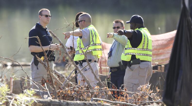 May 15, 2017: Three men were killed and another escaped and is on the run after a chase ended with a crash into a pond on Flint River Road. The two-county chase began when Fayetteville police received a 911 call from a Sprint company security guard about 4:20 a.m. JOHN SPINK/JSPINK@AJC.COM