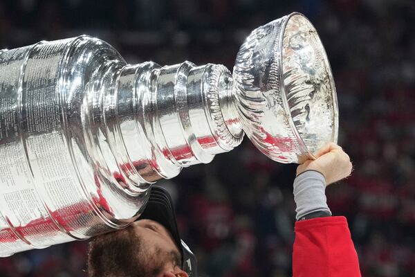 FILE - Florida Panthers center Sam Reinhart (13) kisses the Stanley Cup after defeating the Edmonton Oilers in Game 6 of the NHL hockey Stanley Cup Final Tuesday, June 17, 2025, in Sunrise, Fla. (AP Photo/Lynne Sladky, File)