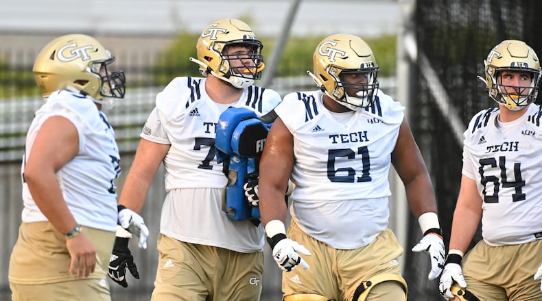 Georgia Tech offensive linemen Bobby Mooney and Michael Maye (61) work on their drills during the first preseason practice Aug. 5 in Atlanta. (Hyosub Shin / Hyosub.Shin@ajc.com)