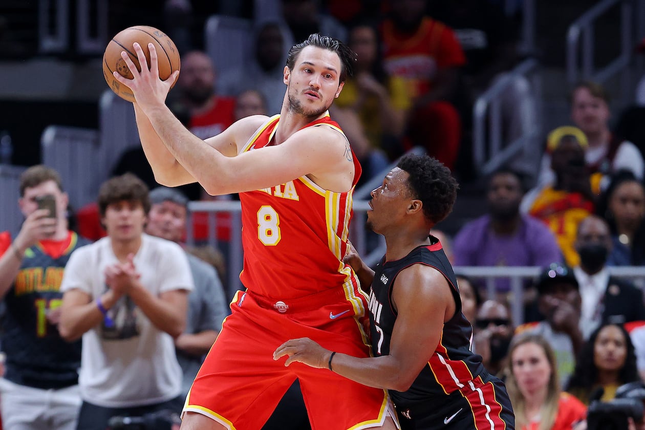The Atlanta Hawks' Danilo Gallinari (center) works against the Miami Heat's Kyle Lowry during Game 3 of an Eastern Conference first-round playoff series at State Farm Arena on April 22, 2022, in Atlanta. (Kevin C. Cox/Getty Images/TNS)