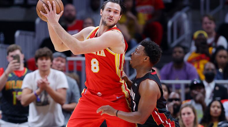 The Atlanta Hawks' Danilo Gallinari (center) works against the Miami Heat's Kyle Lowry during Game 3 of an Eastern Conference first-round playoff series at State Farm Arena on April 22, 2022, in Atlanta. (Kevin C. Cox/Getty Images/TNS)