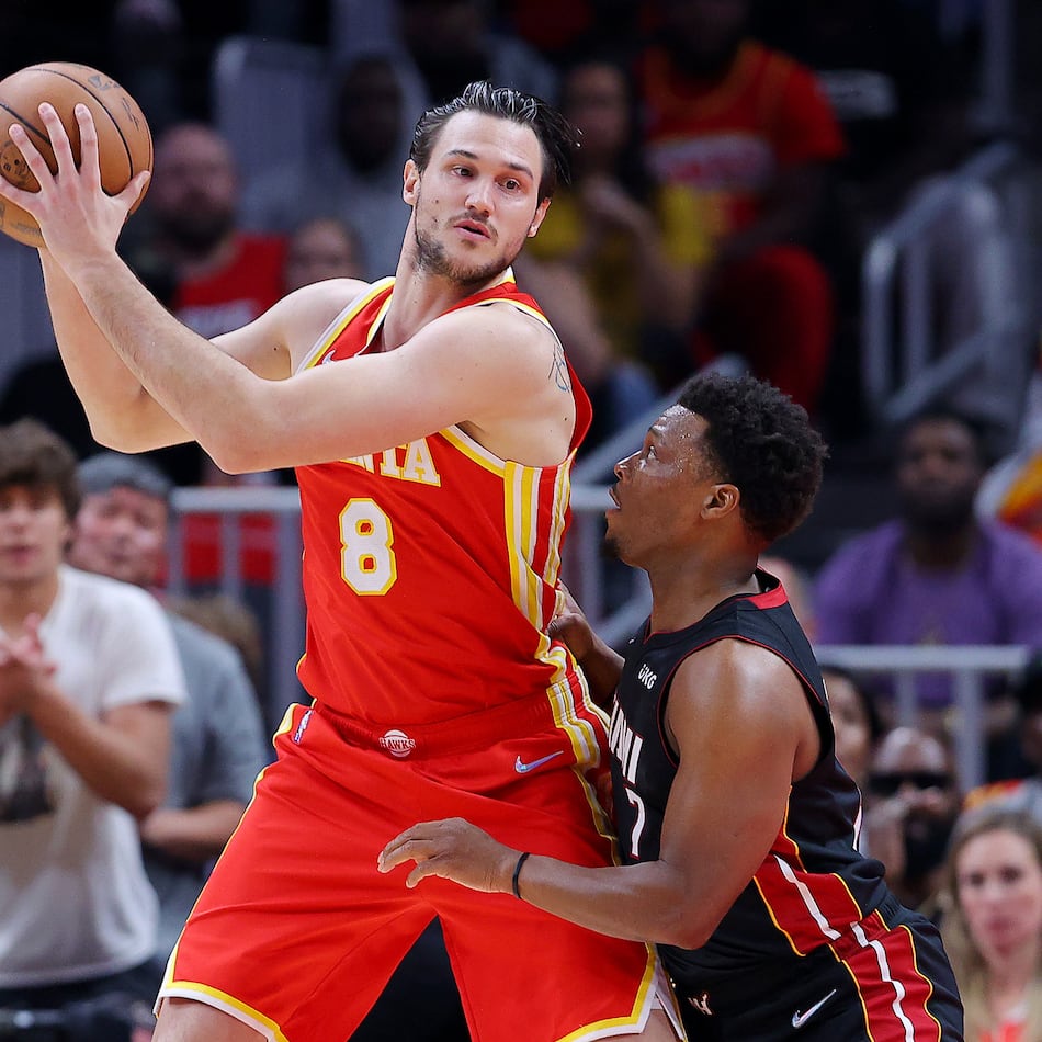 The Atlanta Hawks' Danilo Gallinari (center) works against the Miami Heat's Kyle Lowry during Game 3 of an Eastern Conference first-round playoff series at State Farm Arena on April 22, 2022, in Atlanta. (Kevin C. Cox/Getty Images/TNS)