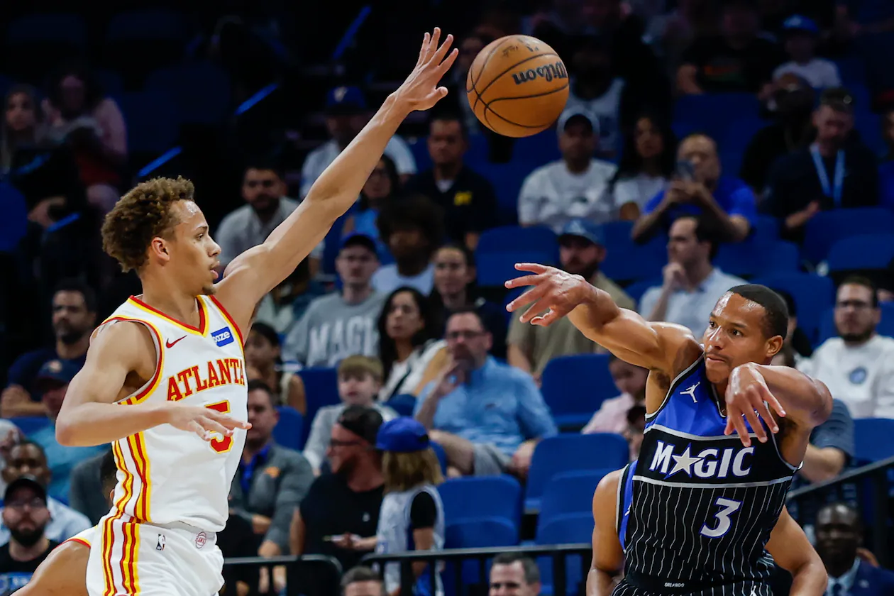 Orlando Magic guard Desmond Bane passes the ball out of the corner as he is defended by Atlanta Hawks guard Dyson Daniels, left, during the first half of an NBA basketball game Wednesday, April 1, 2026, in Orlando, Fla. (Kevin Kolczynski/AP)
