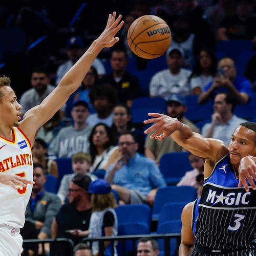 Orlando Magic guard Desmond Bane passes the ball out of the corner as he is defended by Atlanta Hawks guard Dyson Daniels, left, during the first half of an NBA basketball game Wednesday, April 1, 2026, in Orlando, Fla. (Kevin Kolczynski/AP)