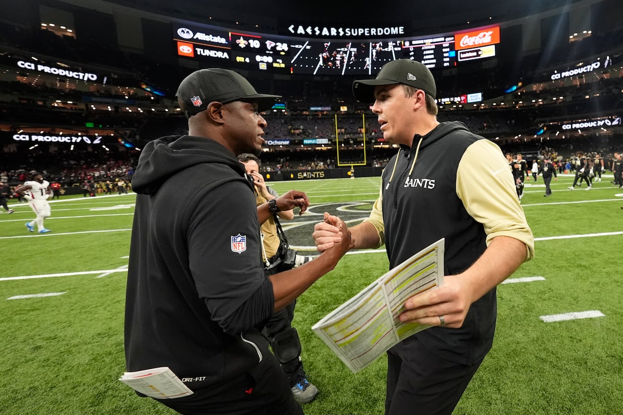 Atlanta Falcons head coach Raheem Morris (left) and New Orleans Saints head coach Kellen Moore shake hands after an NFL football game, Sunday, Nov. 23, 2025, in New Orleans. (Gerald Herbert/AP)