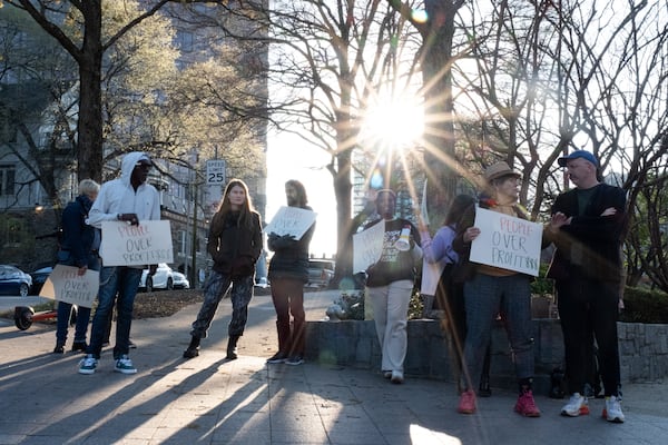 A small group of protesters gathers outside of Woodruff Arts Center as Mayor Andre Dickens delivers the State of the City address Wednesday, March 18, 2026. (Ben Gray for the AJC)