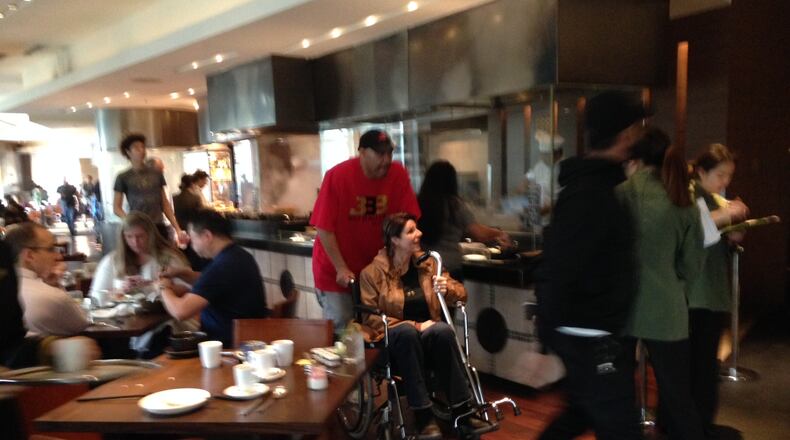 LaVar Ball leaves the restaurant of a Shanghai hotel Wednesday, the day after his son LiAngelo was reportedly arrested for shoplifting with two UCLA teammates.
