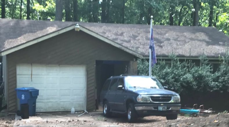 Police said they found a 6-month-old and dogs living inside a house suspected of being a drug manufacturing hub.