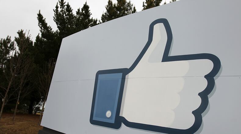 A sign with the “like” symbol stands in front of the Facebook headquarters on February 1, 2012 in Menlo Park, California. (Photo by Justin Sullivan/Getty Images)