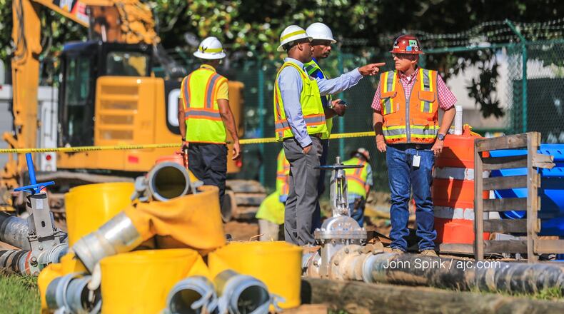 Crews with Atlanta Watershed Management work to fix a leak near the Hemphill Steam Pumping Station on 14th Street. Officials have warned there may be water outages as a result.