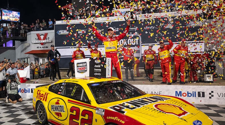 Team Penske driver Joey Logano (22) celebrates in victory lane after winning the Cook Out 400 at Richmond Raceway, Saturday, Aug. 15, 2026, in Richmond Va. (AP Photo/Robert Simmons)