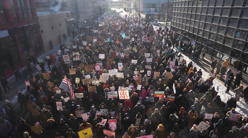 EDS NOTE: OBSCENITY - People protest against ICE (Immigration and Customs Enforcement) in downtown Minneapolis, Sunday, Jan. 25, 2026. (AP Photo/Adam Gray)