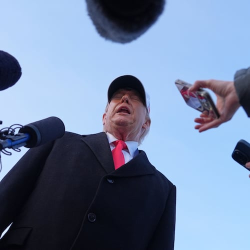 President Donald Trump speaks with reporters at Joint Base Andrews, Tuesday, Jan. 13, 2026, in Joint Base Andrews, Md. (AP Photo/Evan Vucci)