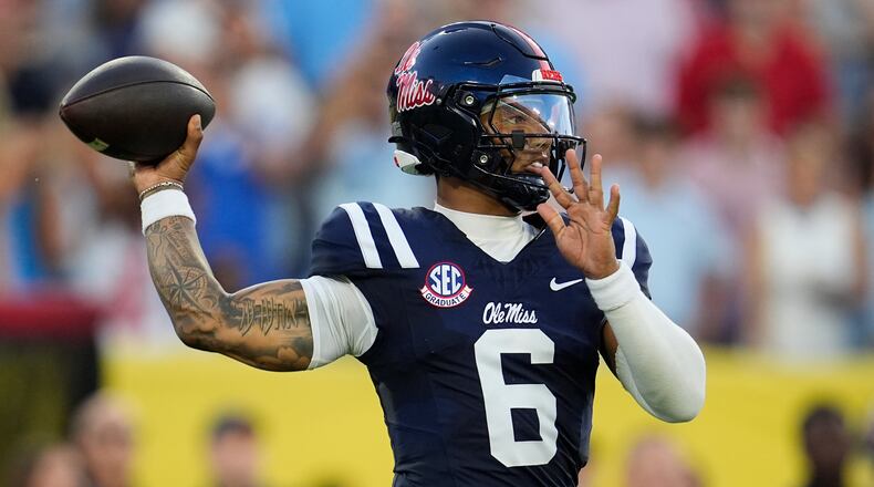 Mississippi quarterback Trinidad Chambliss (6) looks to throw a pass during the first half of an NCAA college football game against Louisville, Sunday, Sept. 6, 2026, in Nashville, Tenn. (AP Photo/George Walker IV)