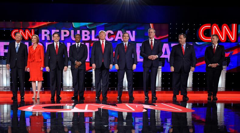 Republican presidential candidates, from left, John Kasich, Carly Fiorina, Marco Rubio, Ben Carson, Donald Trump, Ted Cruz, Jeb Bush, Chris Christie, and Rand Paul take the stage during the CNN Republican presidential debate at the Venetian Hotel & Casino on Tuesday, Dec. 15, 2015, in Las Vegas. (AP Photo/Mark J. Terrill)