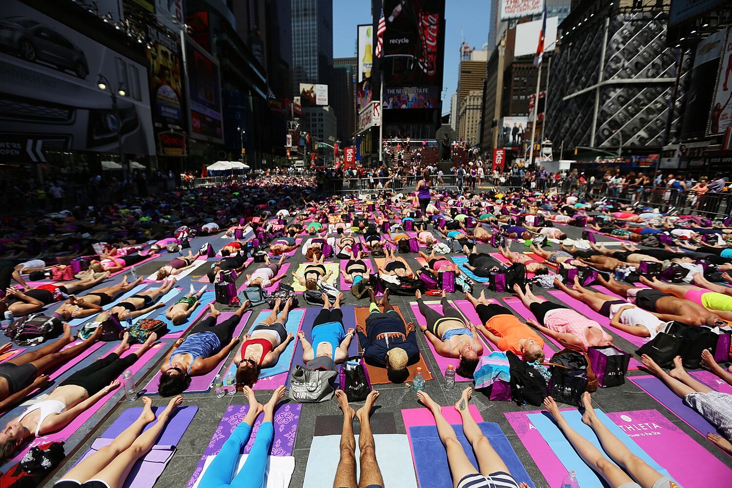 Enthusiasts perform yoga in Times Square to mark summer solstice, June 21, 2013