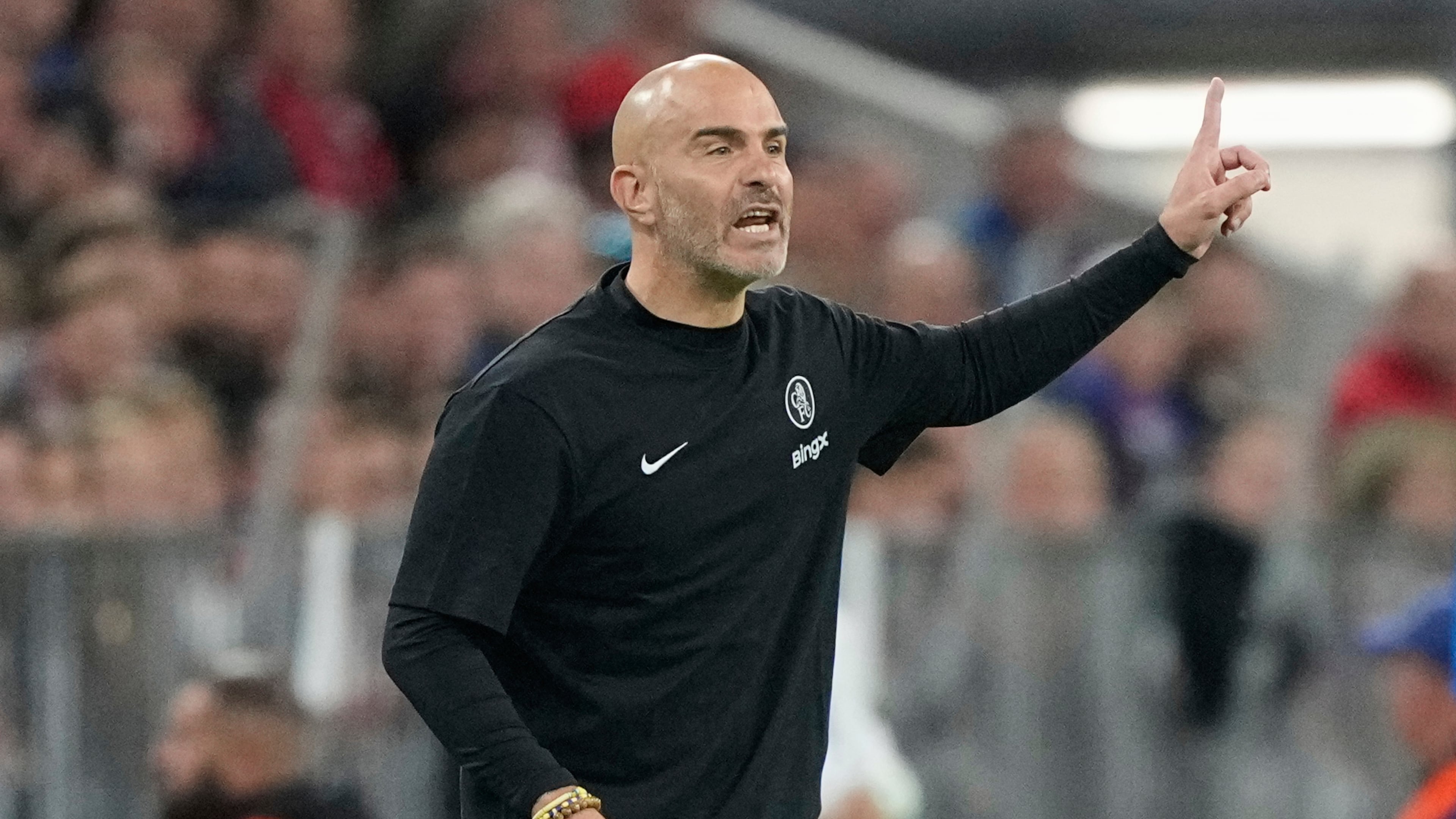 Chelsea's head coach Enzo Maresca gives instructions from the side line during the Champions League opening phase soccer match between FC Bayern Munich and Chelsea at the Allianz Arena in Munich, Germany, Wednesday, Sept. 17, 2025. (AP Photo/Martin Meissner)