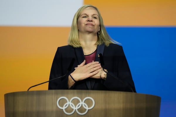 FILE - Kirsty Coventry reacts after she was announced as the new IOC President at the International Olympic Committee 144th session in Costa Navarino, western Greece, March 20, 2025. (AP Photo/Thanassis Stavrakis, File)