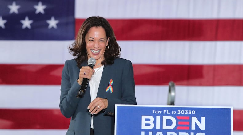 Democratic vice presidential nominee Sen. Kamala Harris responds to cheering supporters as she takes the stage for an early-voting event at the Central Florida Fairgrounds, Monday, October 19, 2020.  (Joe Burbank/Orlando Sentinel/TNS)