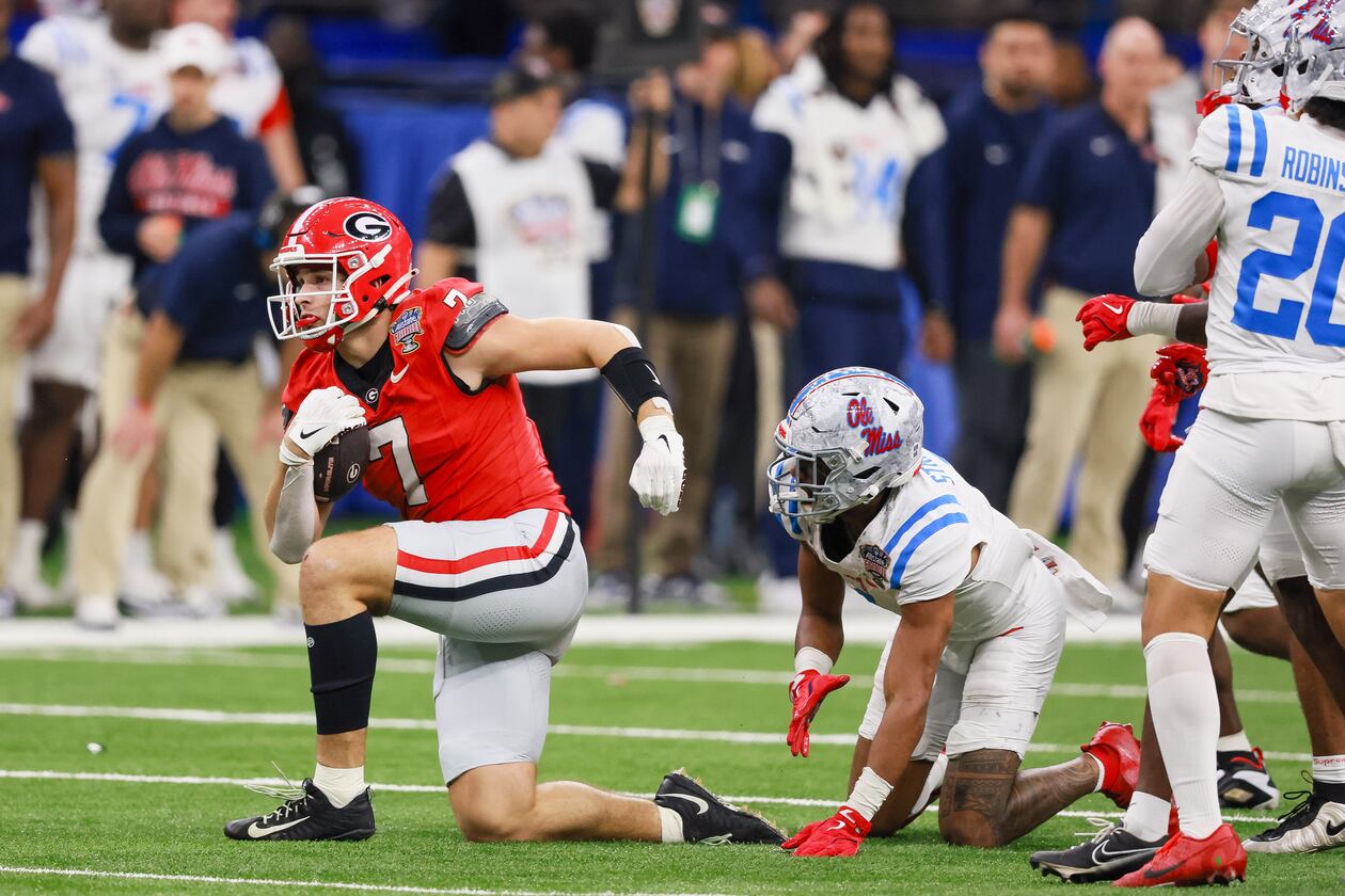 Georgia tight end Lawson Luckie (left) — pictured during the College Football Playoff game against Ole Miss in January — is one of seven Bulldogs who will have an extra year to play in college, should they so choose, under the new "5-in-5." (Jason Getz/AJC 2026)