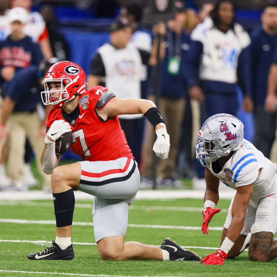 Georgia tight end Lawson Luckie (left) — pictured during the College Football Playoff game against Ole Miss in January — is one of seven Bulldogs who will have an extra year to play in college, should they so choose, under the new "5-in-5." (Jason Getz/AJC 2026)
