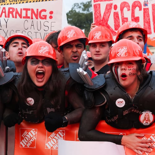 UGA fans pose for photos before the ESPN College GameDay broadcast from Myers Quad at UGA on Saturday, Oct. 18, 2025. (C.J. Bartunek for the AJC)