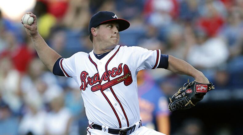 Atlanta Braves starter Kris Medlen works in the first inning of a baseball game against the New York Mets, Wednesday, June 19, 2013, in Atlanta. (AP Photo/John Bazemore)