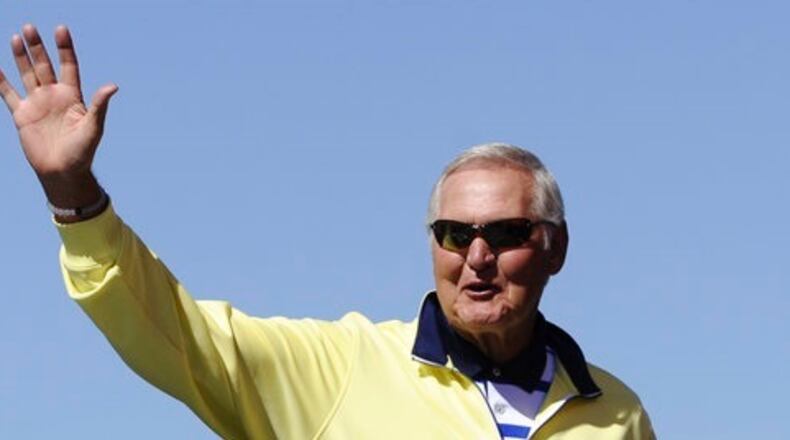 In this Sept. 20, 2015, file photo, former NBA player Jerry West greets fans during drivers introduction for the NASCAR Sprint Cup Series auto race at Chicagoland Speedway in Joliet, Ill. West could be leaving his job as an adviser to the NBA champion Golden State Warriors to take a similar role with the Los Angeles Clippers. West told ESPN he's intrigued at the prospect of working for team owner Steve Ballmer, whom he calls "a winner." (AP Photo/Matt Marton, File)