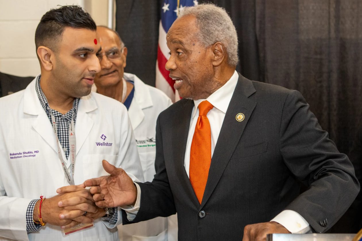 U.S. Rep. David Scott hosts his annual health fair on Saturday, Aug. 16, 2025, where he meets Wellstar Dr. Rakendu Shukla at Rockdale County High School in Conyers. (Jenni Girtman for the AJC)