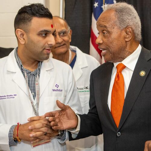 U.S. Rep. David Scott hosts his annual health fair on Saturday, Aug. 16, 2025, where he meets Wellstar Dr. Rakendu Shukla at Rockdale County High School in Conyers. (Jenni Girtman for the AJC)