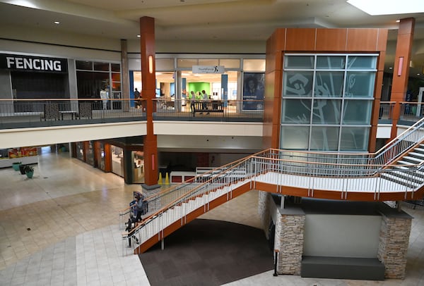 People walk by the Youth Force Innovation Hub on the top level inside Georgia Square Mall in Athens in May 2025. Youth Force Innovation Hub is a workforce development initiative of the Boys and Girls Club of Athens. (Hyosub Shin/AJC)