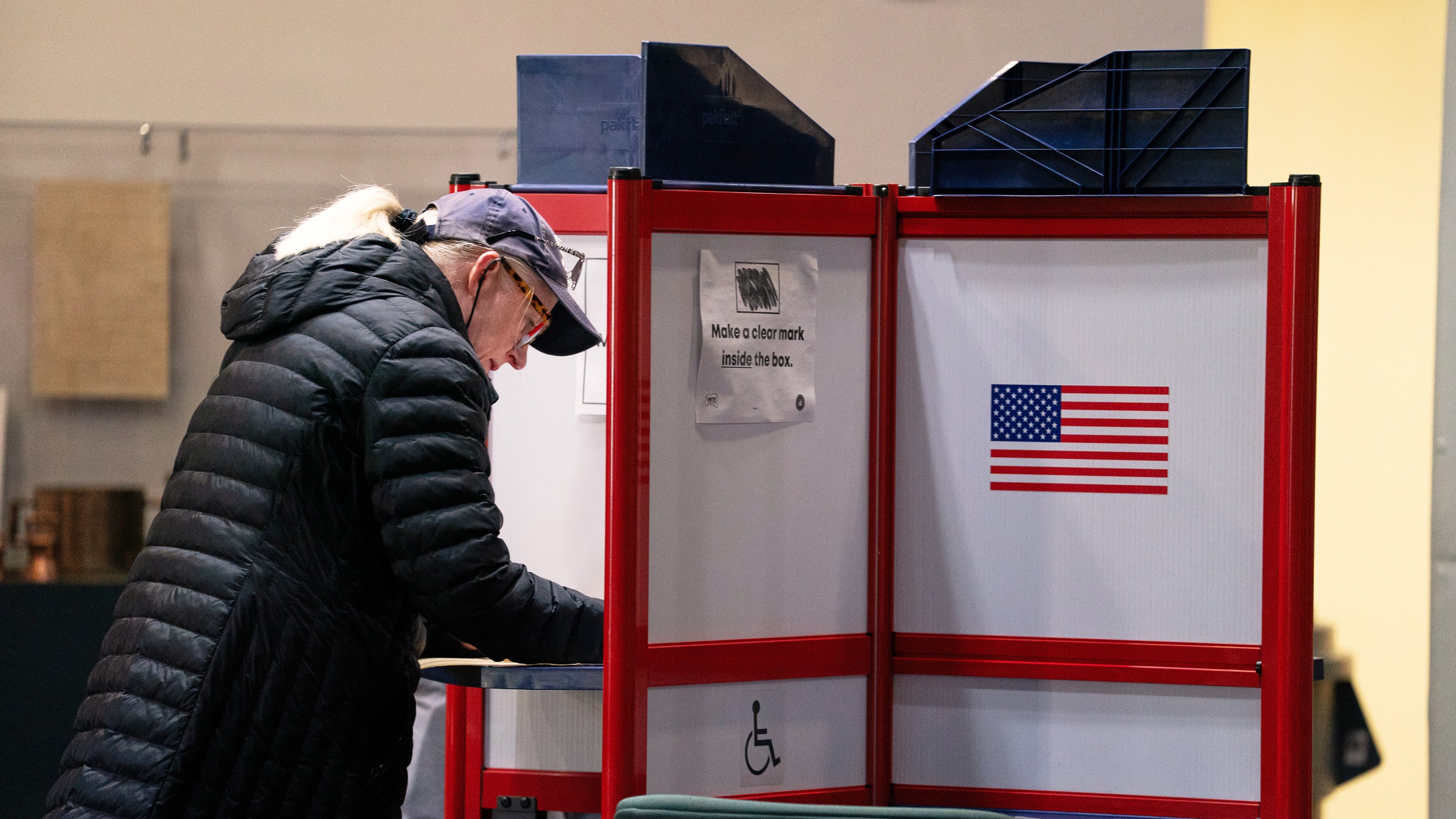 A voter completes her ballot at Alexandria City Hall, Tuesday, Nov. 4, 2025, in Alexandria, Va. (AP Photo/Allison Robbert)