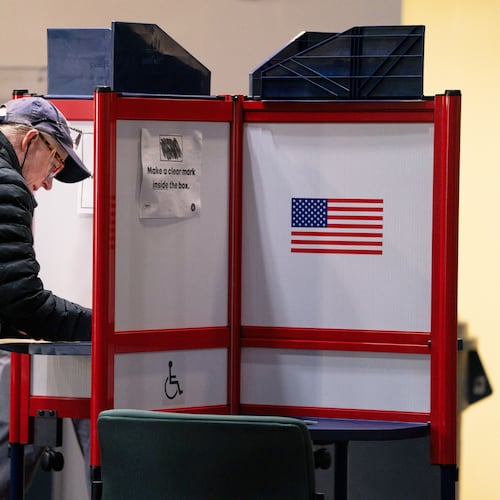 A voter completes her ballot at Alexandria City Hall, Tuesday, Nov. 4, 2025, in Alexandria, Va. (AP Photo/Allison Robbert)