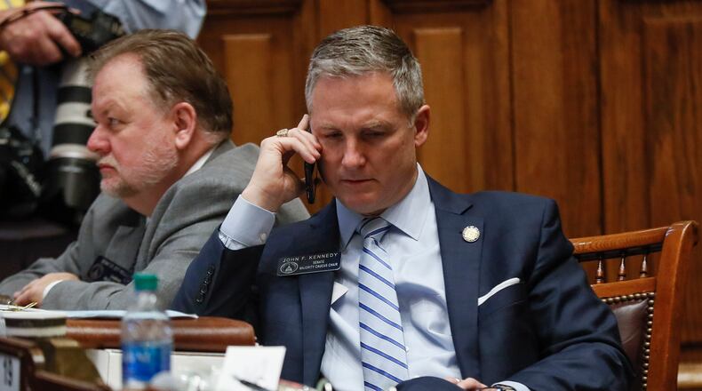 Georgia Sen. John F. Kennedy, R - Macon, talks on his phone on the Senate floor in February 2020. Bob Andres / bandres@ajc.com