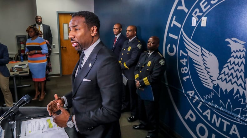 Atlanta Mayor Andre Dickens speaks at the podium on Tuesday, March 15, 2022, at a news conference at Atlanta's public safety headquarters. (John Spink / John.Spink@ajc.com)