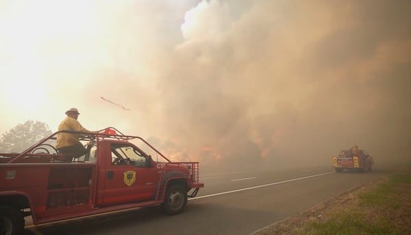 Smoke fills the sky as firefighters battle a wildfire in Lacey Townships, N.J. on Tuesday, April 22, 2025. (New Jersey Department of Environmental Protection via AP)