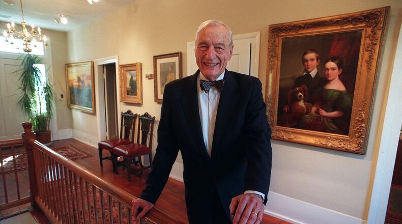 Cobb attorney Fred Bentley with some of the art he collected over the years. Bentley influenced the county, having a hand in founding or serving in institutions from government to local nonprofits. PHOTO BY ANDY SHARP/STAFF.