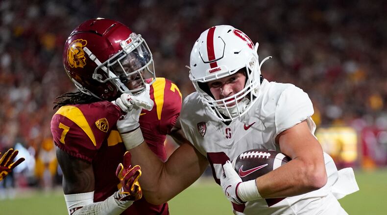 Southern California safety Calen Bullock (7) defends against Stanford tight end Benjamin Yurosek (84) during the second half of an NCAA college football game in Los Angeles, Saturday, Sept. 9, 2023. (AP Photo/Ashley Landis)
