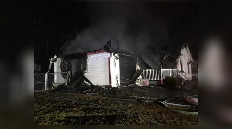 A man was injured in a  house fire in unincorporated Lawrenceville after he went inside to save his dog.