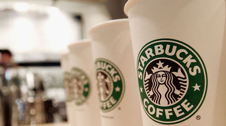 NEW YORK - AUGUST 5: Beverage cups featuring the logo of Starbucks Coffee are seen in the new flagship store on 42nd Street August 5, 2003 in New York City. The Seattle-based coffee company has emerged as the largest food chain in the Manhattan borough of New York with 150 outlets. (Photo by Stephen Chernin/Getty Images)