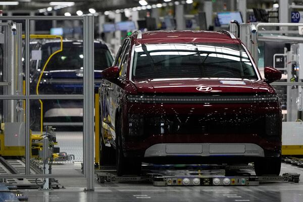 Vehciles move on the line during a media tour at the Hyundai Motor Group Metaplant America, Wednesday, March 26, 2025, in Ellabell, Ga. (AP Photo/Mike Stewart)