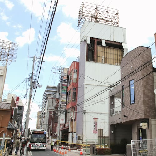 The wall of a building is seen partly damaged following an earthquake in Hachinohe, Aomori prefecture northern Japan, Thursday, June 25, 2026. (Kyodo News via AP)
